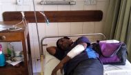 Sri Lankan writer Lasantha Wijeratne receives treatment in a hospital in Galle on November 14, 2019, after being stabbed by armed men. (AFP)