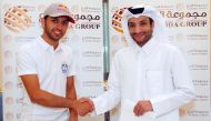 Al Bidda Group Chairman Sheikh Suhaim bin Abdul Aziz Al Thani and Qatar rising squash player Abdulla Al Tamimi shake hands after signing the sponsorship deal in Doha, yesterday.