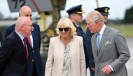 Britain's Prince Charles and his wife Camilla, Duchess of Cornwall, are greeted as they arrive at RNZAF Whenuapai in Auckland, New Zealand, November 17, 2019. REUTERS/Tracey Nearmy