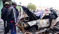 Burned vehicles are seen at a transit station after protests on Friday night, following former Bolivian President Evo Morales' exit from the country, in El Alto, Bolivia, November 16, 2019. REUTERS/Andrea Martinez