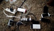 Mobile devices belonging to Cuban migrants are seen charging at an improvised shelter as they wait for a humanitarian visa to the United States in Mapastepec Chiapas state, Mexico, April 10, 2019. Reuters /  Jose Cabezas