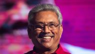 In this file photo taken on November 13, 2019 Sri Lanka Podujana Peramuna (SLPP) party presidential candidate Gotabaya Rajapaksa smiles during a campaign rally in Homagama ahead of the November 16 presidential election.  AFP / Jewel SAMAD 