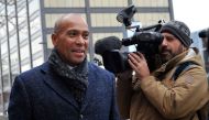 Former Massachusetts Governor Deval Patrick (L), US Democratic Presidential hopeful, makes his way to the Bridge Cafe to order lunch, greet locals and talk to reporters on November 14, 2019 in Concord, New Hampshire. AFP / Joseph Prezioso
 