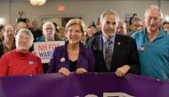 Democratic presidential hopeful Massachusetts' Senator Elizabeth Warren takes a group photo with members of SEA/SEIU Local 1984, state employees, at the Holiday Inn in Concord New Hampshire, after signing papers to officially enter the New Hampshire Prima