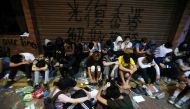 Protesters wait to receive medical attention at the Hong Kong Polytechnic University campus during protests in Hong Kong, China, November 19, 2019. REUTERS/Adnan Abidi
 
