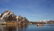 A fishing boat enters the harbour at the Arctic port of Svolvaer in northern Norway, March 4, 2013. Reuters / Alister Doyle