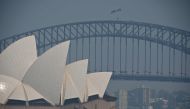 The Sydney Opera House and Harbour Bridge are seen through a smokey haze which blankets Sydney on November 21, 2019. AFP / PETER PARKS