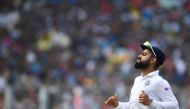 India's cricket team captain Virat Kohli runs to field a ball during the first day of the second Test cricket match of a two-match series between India and Bangladesh at The Eden Gardens cricket stadium in Kolkata on November 22, 2019. / AFP / Dibyangshu 