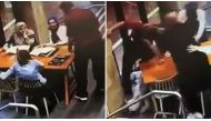 Shocking security camera footage showed a man approaching a table of three women wearing headscarves as they chatted at a cafe in the city's west on Wednesday.