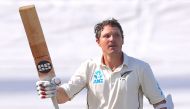 New Zealand's BJ Watling celebrates reaching his century during the third day of the first Test cricket match between England and New Zealand at Bay Oval in Mount Maunganui on November 23, 2019. / AFP / DAVID GRAY
