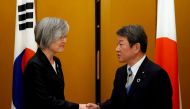 Japan's Foreign Minister Toshimitsu Motegi shakes hands with South Korea's Foreign Minister Kang Kyung-wha before the G20 foreign ministers meeting in Nagoya, Japan November 23, 2019. Eugene Hoshiko/Pool via REUTERS