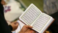 A woman reads the Quran during the Friday prayers in Tehran, Iran November 22, 2019. Nazanin Tabatabaee/WANA (West Asia News Agency) via Reuters