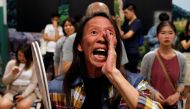 A woman reacts during the counting of the votes of the Hong Kong council elections, in a polling station in Hong Kong, China November 25, 2019. Reuters/Adnan Abidi
