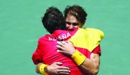 Spain captain Sergi Bruguera celebrates with Rafael Nadal after winning his doubles match with Feliciano Lopez against Britian's Jamie Murray and Neal Skupski. Reuters/Sergio Perez
