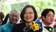 Taiwan's President Tsai Ing-wen (C) speaks after registering as a presidential candidate outside the Central Elections Committee in Taipei on November 19, 2019. AFP / Sam Yeh