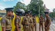 This photo taken on October 2, 2019 shows police officers standing outside the Supreme Court Complex of Sri Lanka in Colombo. The Sri Lankan government has put airports on alert to stop police detectives leaving without permission after a top officer who 