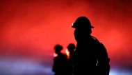 Firefighters battle a wildfire dubbed the Cave Fire burning in the hills of Santa Barbara, California, US, November 26, 2019. Reuters/David McNew