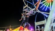 This photo taken on November 6, 2019 shows crew members operating a human-powered ferris wheel in Taunggyi, Shan state. AFP / Ye Aung Thu
 