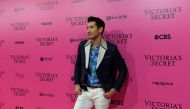 (FILES) In this file photo taken on November 20, 2017 Canadian actor Godfrey Gao a.k.a. Godfrey Tsao poses on the 