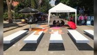 People paint a 3D pedestrian crossing in Kanchanaburi province, Thailand October 25, 2019. Picture taken October 25, 2019. REUTERS/Prapan Chankaew