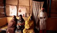 Sudanese women wait to consult a doctor at a maternity clinic in Al Fasher, northern Darfur, March 16, 2009. Reuters/Zohra Bensemra