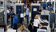 A man is screened with a backscatter x-ray machine as travellers go through a TSA security checkpoint in terminal 4 at LAX, Los Angeles International Airport, May 2, 2011. Reuters/Danny Moloshok
