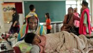 People take shelter at a camp during the cyclone Roanu in Chittagong, Bangladesh, May  21, 2016. EPA