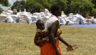 A Zimbabwean mother goes to collect her monthly rations of food aid in the Rushinga district of Mt Darwin, about 254km north of Harare, March 7, 2013. Reuters / Philimon Bulawayo