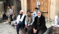 Residents sit in the historic neighbourhood of Murad Khani in Kabul's Old City, Afghanistan, on November  4 2019. Thomson Reuters Foundation/Rina Chandran