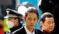 FILE PHOTO: South Korean singer Jung Joon-young arrives for questioning on accusations of illicitly taping and sharing sex videos on social media, at the Seoul Metropolitan Police Agency in Seoul, South Korea, March 14, 2019. REUTERS/Kim Hong-Ji/File Phot