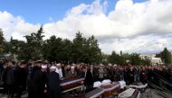 Relatives and family attend the funeral of eight Lala family members who died during the earthquake in Durres, on November 30, 2019. AFP / Gent SHKULLAKU