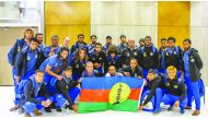 Hienghene Sport players and officials pose for a group photo upon their arrival in Doha.