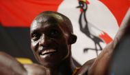 FILE PHOTO: Uganda's Joshua Cheptegei celebrates winning gold at the IAAF Championships in Doha 2019. Reuters/Aleksandra Szmigiel/File Photo