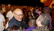Suriname's President Desi Bouterse, who was convicted of murder for the execution of opponents by a court in Suriname, greets friends and government officials after arriving from China, in Paramaribo, Suriname December 1, 2019. Reuters/Ranu Abhelakh
 