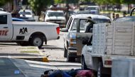 FILE PHOTO: Corpses lie on the street after heavily armed gunmen waged an all-out battle against Mexican security forces in Culiacan, Sinaloa state, Mexico, on October 18, 2019. AFP / Alfredo Estrella
 