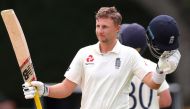 England's batsman Joe Root celebrates his double century (200 runs) on day four of the second cricket Test match between England and New Zealand at Seddon Park in Hamilton on December 2, 2019. / AFP / DAVID GRAY