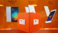 FILE PHOTO: The logo of Xiaomi is seen inside the company's office in Bengaluru, India, January 18, 2018. Reuters /Abhishek N. Chinnappa