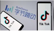 Tik Tok logos are seen on smartphones in front of a displayed ByteDance logo in this illustration taken November 27, 2019. REUTERS/Dado Ruvic/Illustration
