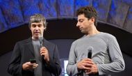 FILE PHOTO: Larry Page (L) and Sergey Brin, co-founders of Google, show the new G1 phone running Google's Android software in New York September 23, 2008. REUTERS/Jacob Silberberg/File Photo
 