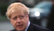Britain's Prime Minister Boris Johnson speaks to the press on arrival at the NATO summit at the Grove hotel in Watford, northeast of London on December 4, 2019. / AFP / DANIEL LEAL-OLIVAS