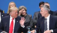 US President Donald Trump (L) speaks with NATO Secretary General Jens Stoltenberg during the plenary session of the NATO summit at the Grove hotel in Watford, northeast of London on December 4, 2019. / AFP / POOL / LUDOVIC MARIN