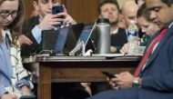 Journalists use their phones as constitutional scholars testify before the House Judiciary Committee in the Longworth House Office Building on Capitol Hill December 4, 2019 in Washington, DC. Sarah Silbiger/Getty Images/AFP