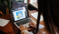 This photo taken on July 3, 2019 shows Chinese artist River Rui looking at an image of her 