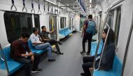 This picture taken on March 12, 2019 shows passengers on board a Jakarta mass rapid transit MRT coach during a trial run in the city. AFP / Bay Ismoyo