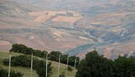 Electricity pylons of a high-tension electricity power line are seen outside the village of Qalaalti, Azerbaijan, June 20, 2016. Reuters/Maxim Shemetov 