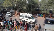 A hospital vehicle carries the body of a rape victim to her residence in New Delhi, India, December 7, 2019. REUTERS/Adnan Abidi
