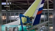 Boeing employees work on the tail of a Boeing 737 NG at the Boeing plant in Renton, Washington December 7, 2015. REUTERS/Matt Mills McKnight
