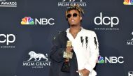 Juice Wrld poses with the award for Best New Artist during the 2019 Billboard Music Awards . May 1, 2019/ AFP / Amy Sussman