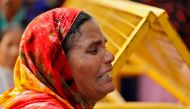 A relative of a victim of a fire that swept through a factory where laborers were sleeping, cries outside a hospital mortuary in New Delhi, India December 8, 2019. Reuters/Adnan Abidi