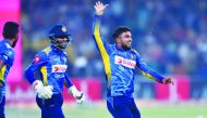 File photo of Sri Lanka's spinner Wanindu Hasaranga (R) celebrates with teammates after dismissal of Pakistan's captain Sarfraz Ahmed during the second Twenty20 International cricket match between Pakistan and Sri Lanka at the Gaddafi Cricket Stadium in L